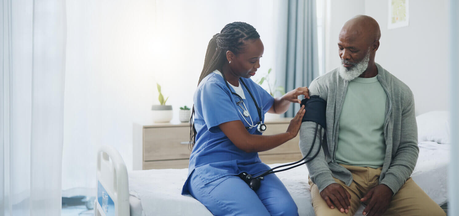 Man getting his blood pressure checked at his annual physical checkup.
