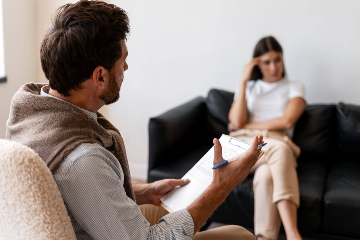 professional doctor counseling patient about mental health issues like anxiety disorder.