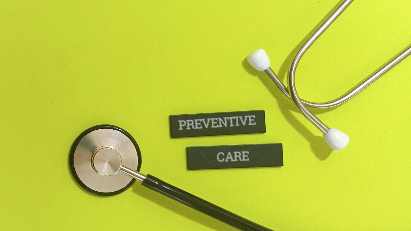 Stethoscope on bright green background with preventive care